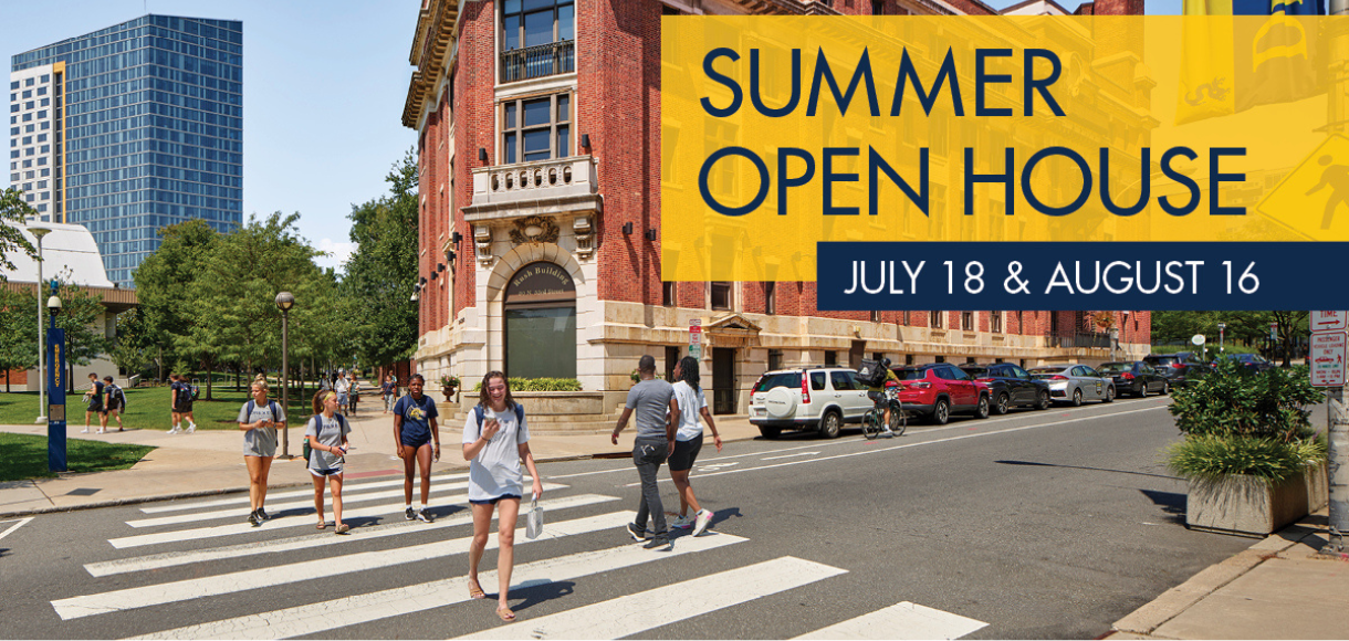 students walking across campus on a summer day